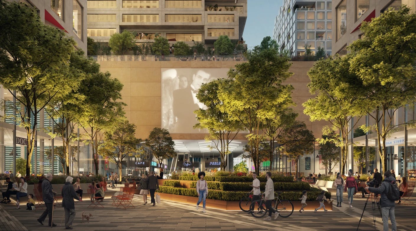 Rendering of an outdoor courtyard with people walking and a movie projected on the side of a building
